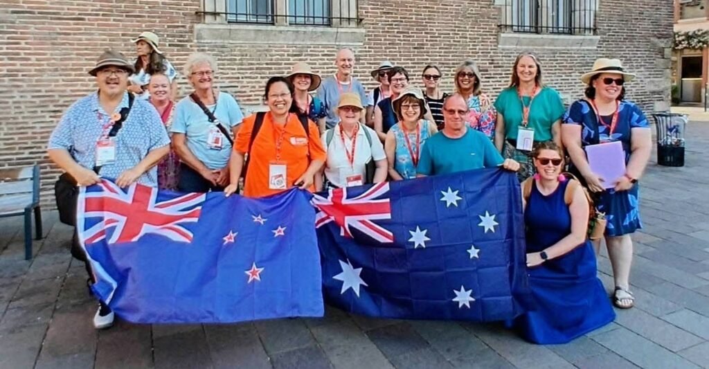Photograph showing member os the Australian and NZ Urban Sketching Contingent with flags l